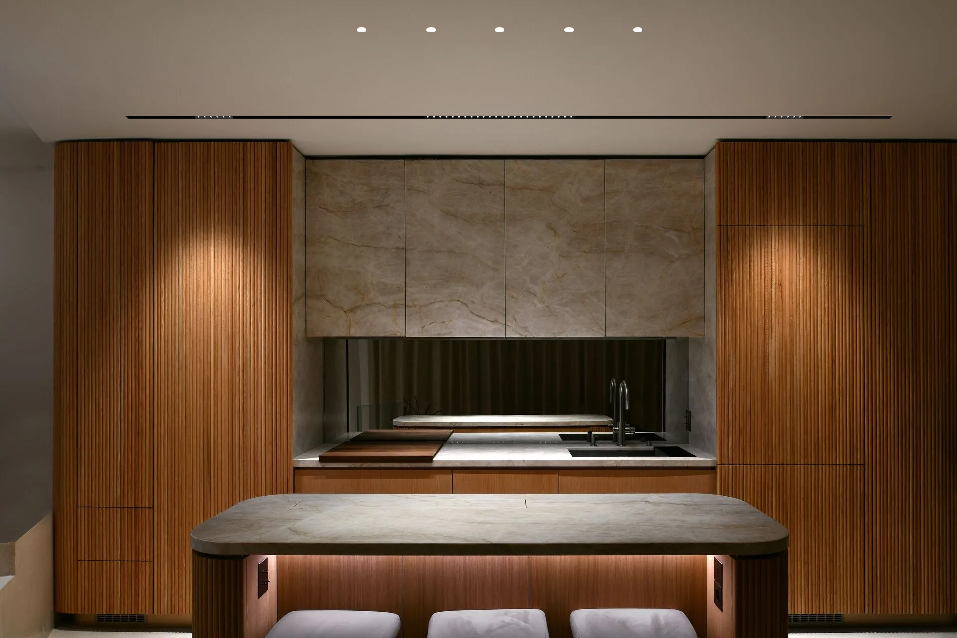 Minimalist living room lighting design using magnetic track lighting and round recessed LED fixtures