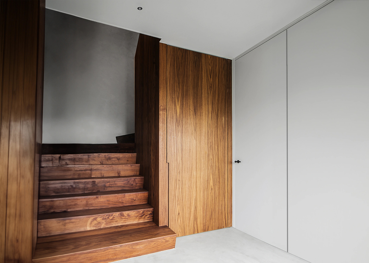 Deep recessed pinhole downlight for glare free accent lighting in luxury homes and modern retail interiors